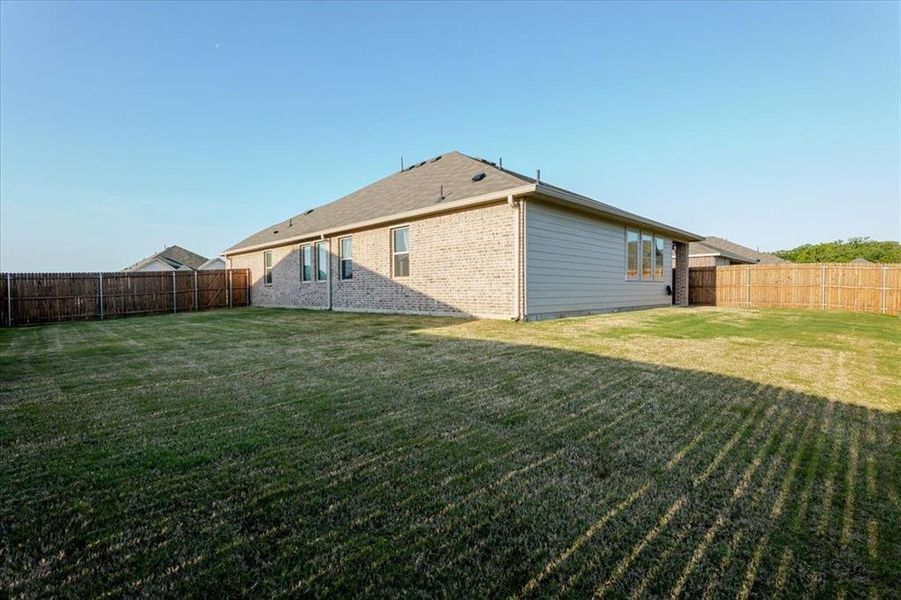 Exterior details and patio area of a home in Azle Grove, Azle (Image 27).