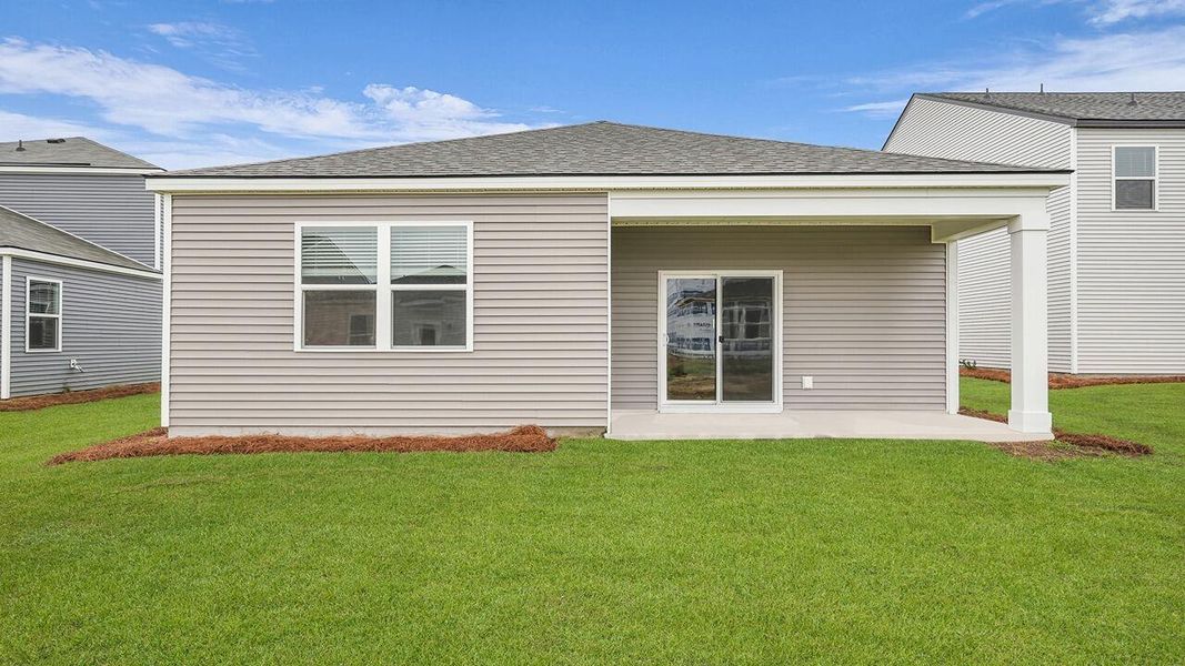 Exterior details and patio area of a home in Pine Hills at Cane Bay, Summerville (Image 20).