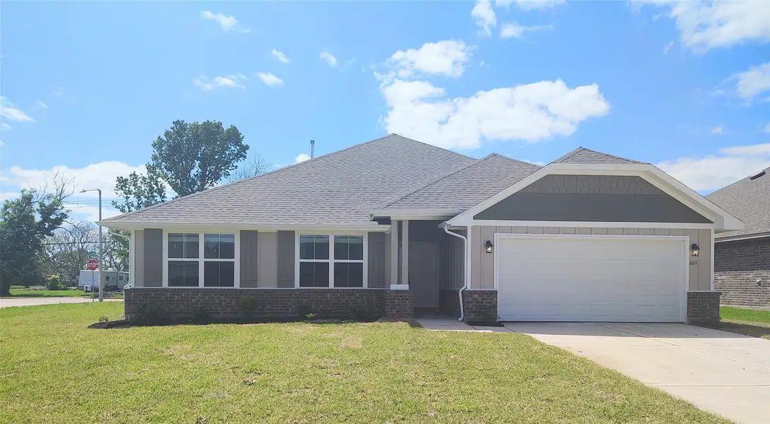 Front exterior of a new home in Greystone, Angleton, TX, highlighting curb appeal (Image 2). Front exterior of a new home in Greystone, Angleton, TX, highlighting curb appeal (Image 2).