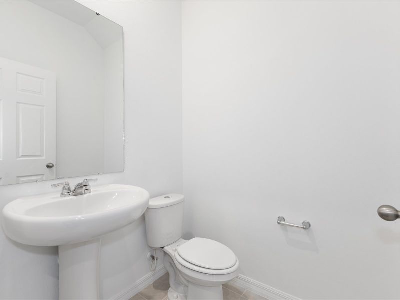 Half bathroom in the Ellison floorplan at 4621 Cross Prairie Parkway in The Meadow at Crossprairie