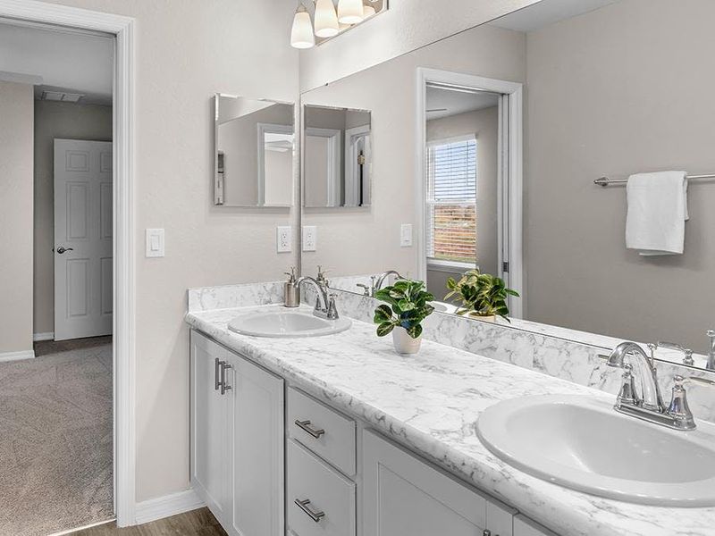 This home includes two additional upstairs baths including this Jack-and-Jill bath, plus a downstairs powder room.