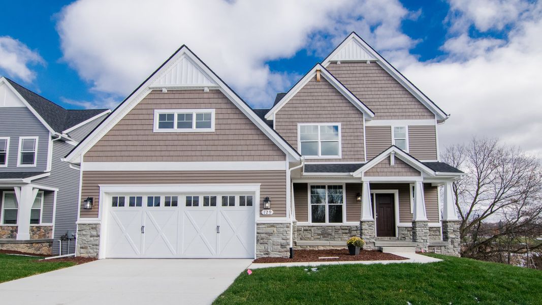 Representative exterior photo of a completed home built from the The Hartland by Norfolk Homes in Coronado Estates, Jackson, MI (Image 29).