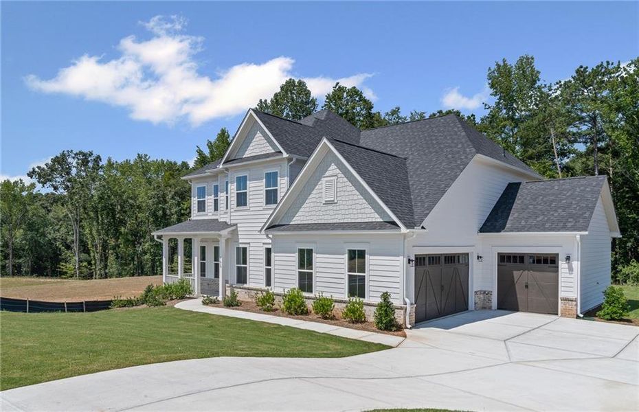 Front exterior of a new home in Traditions of Braselton, Jefferson, GA, highlighting curb appeal (Image 19).