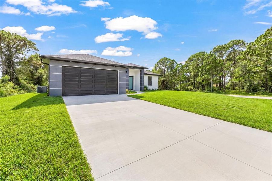 Front exterior of a new home in , Lehigh Acres, FL, highlighting curb appeal (Image 15).