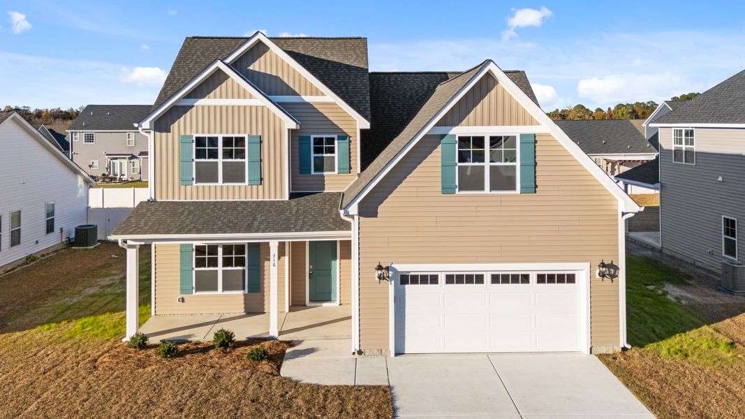 Front exterior of a new home in Arbor Hills South II, Greenville, NC, highlighting curb appeal (Image 1).