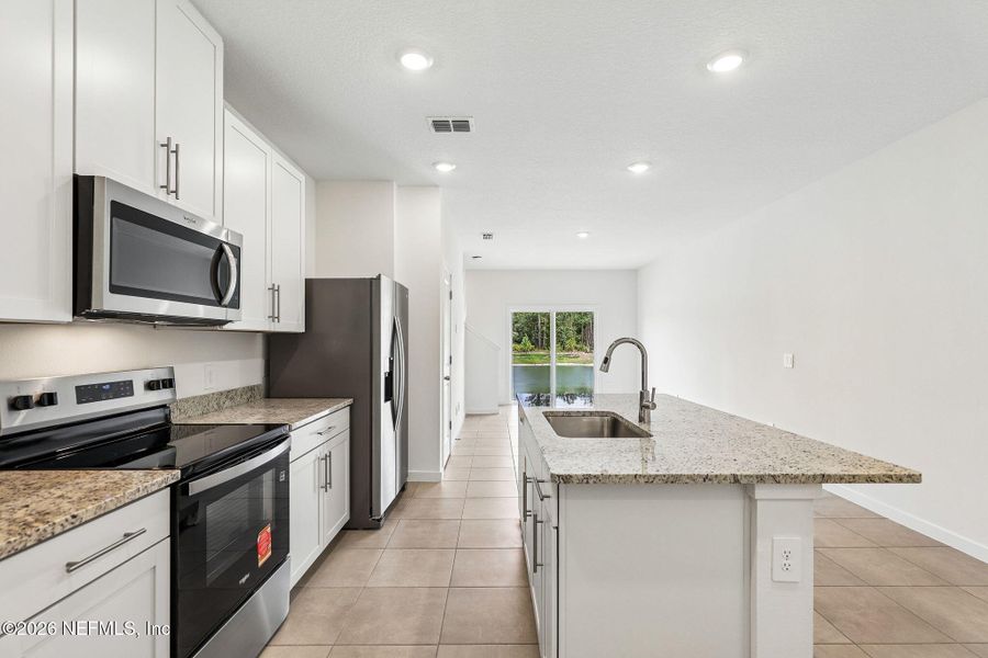 Furnished interior view inside a new home in The District at Oakleaf - The Commons, Middleburg (Image 10).