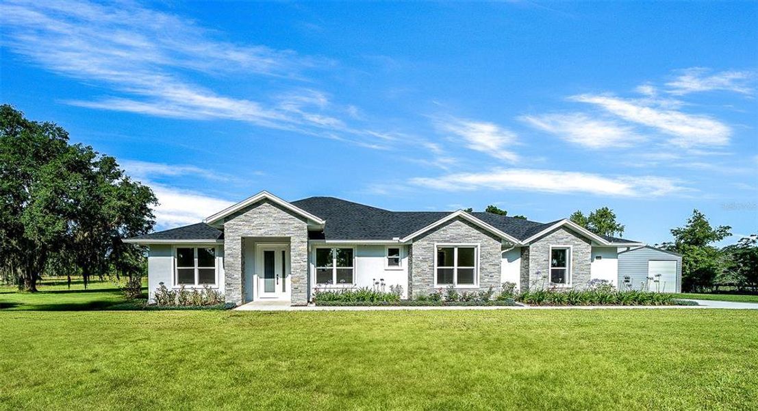 Front exterior of a new home in , Ocala, FL, highlighting curb appeal (Image 26).