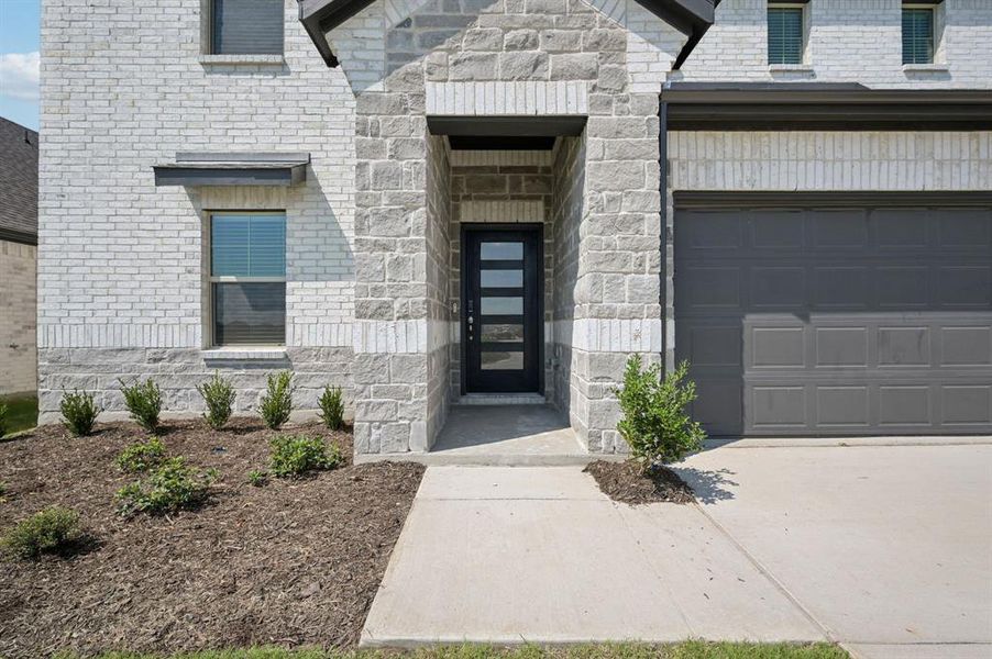Front exterior of a new home in Windmore, Princeton, TX, highlighting curb appeal (Image 24).