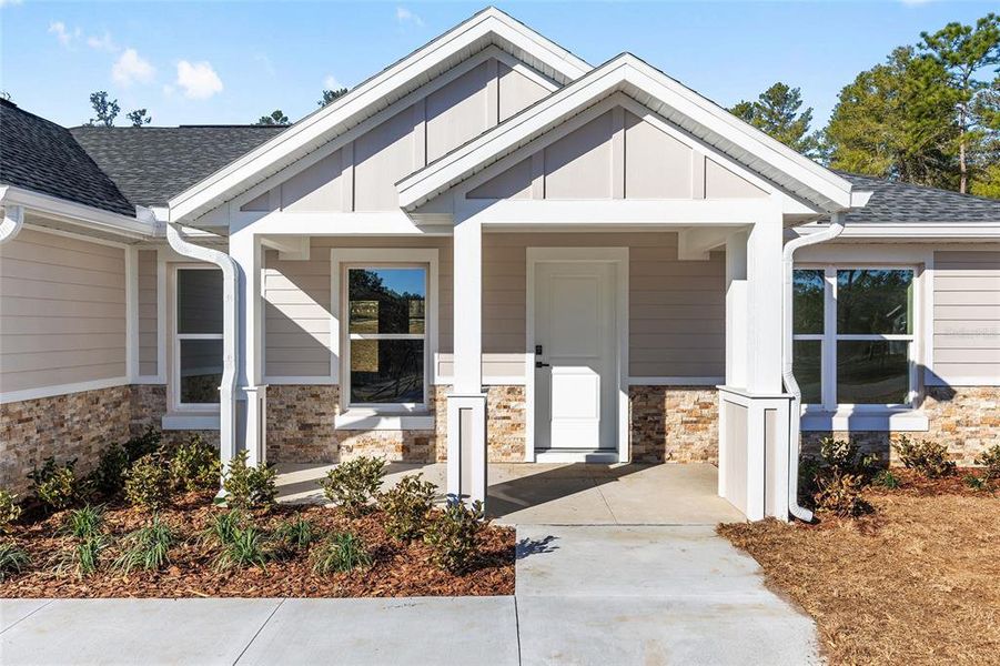 Front exterior of a new home in , Dunnellon, FL, highlighting curb appeal (Image 20).