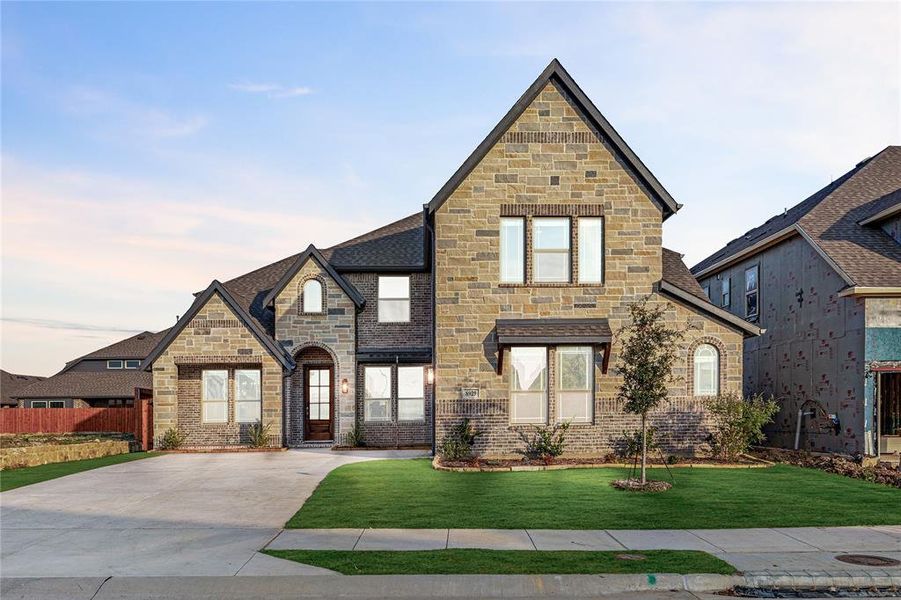 Front exterior of a new home in Country Lakes Classic 60, Argyle, TX, highlighting curb appeal (Image 1).