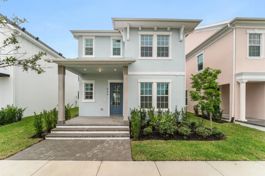 Front exterior of a new home in Newfield, Palm City, FL, highlighting curb appeal (Image 1). Front exterior of a new home in Newfield, Palm City, FL, highlighting curb appeal (Image 1).