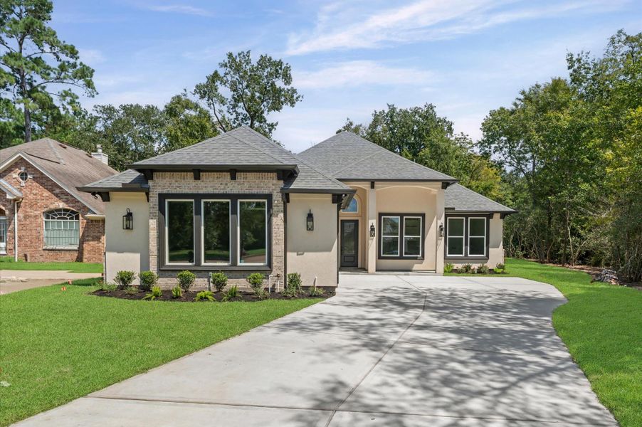 Front exterior of a new home in , Montgomery, TX, highlighting curb appeal (Image 2). Front exterior of a new home in , Montgomery, TX, highlighting curb appeal (Image 2).