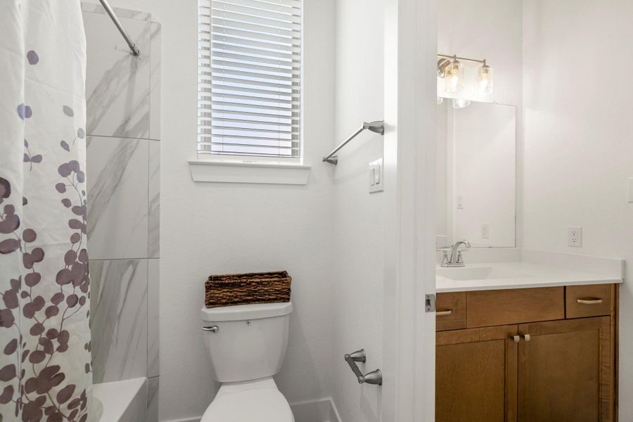 A jack and jill bathroom is the perfect set up for sharing! This private vanity area features an oversized vanity with quartz countertops, a large mirror, and plenty of storage. A jack and jill bathroom is the perfect set up for sharing! This private vanity area features an oversized vanity with quartz countertops, a large mirror, and plenty of storage.