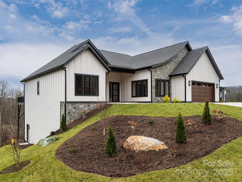 Front exterior of a new home in , Candler, NC, highlighting curb appeal (Image 1). Front exterior of a new home in , Candler, NC, highlighting curb appeal (Image 1).