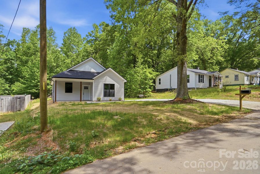 Front exterior of a new home in , Statesville, NC, highlighting curb appeal (Image 21).