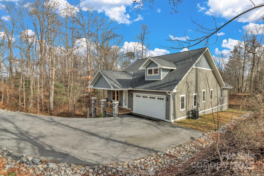 Front exterior of a new home in , Hendersonville, NC, highlighting curb appeal (Image 21).