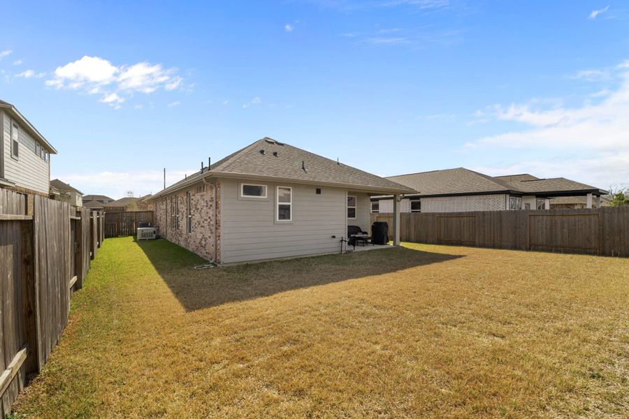 Exterior details and patio area of a home in , Iowa Colony (Image 22).