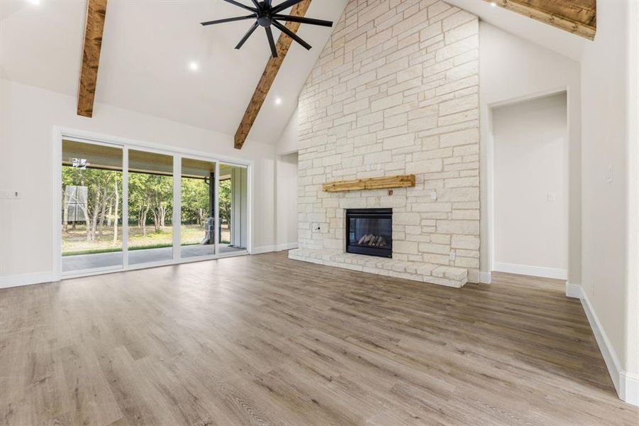 Gas log fireplace with floor to ceiling stone Gas log fireplace with floor to ceiling stone