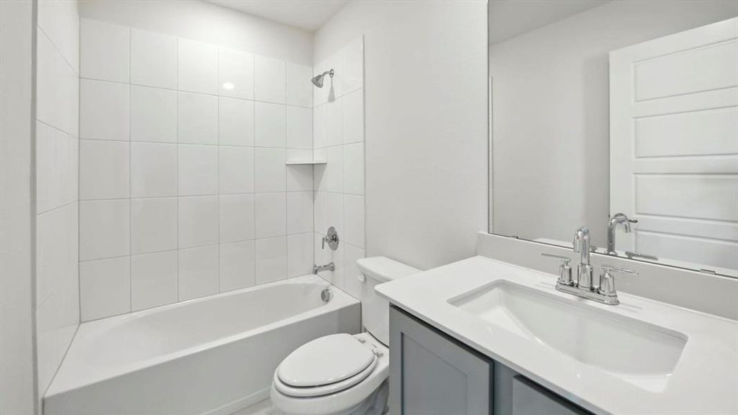 Bathroom with vanity and shower / tub combination