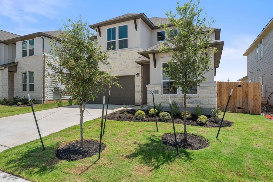 Front exterior of a new home in Lagos Reserve, Manor, TX, highlighting curb appeal (Image 1). Front exterior of a new home in Lagos Reserve, Manor, TX, highlighting curb appeal (Image 1).