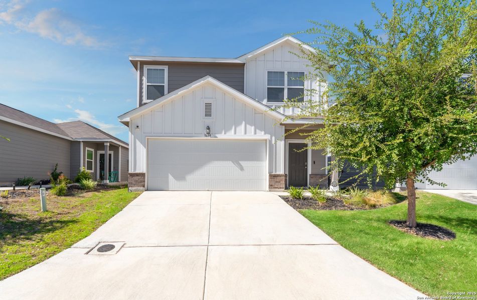 Front exterior of a new home in Liberte, Converse, TX, highlighting curb appeal (Image 2). Front exterior of a new home in Liberte, Converse, TX, highlighting curb appeal (Image 2).
