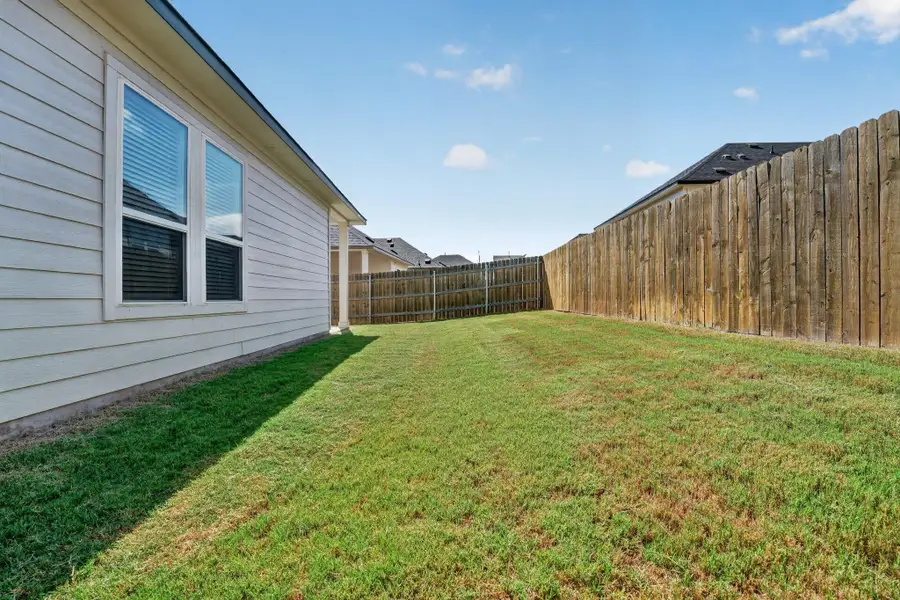 Exterior details and patio area of a home in Cascades at Onion Creek, Austin (Image 3).