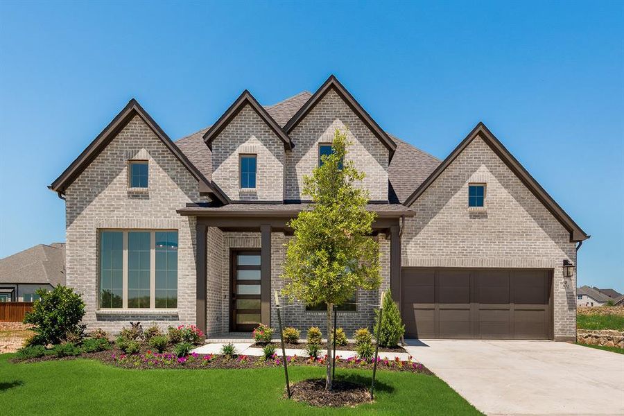 Front exterior of a new home in The Homestead - 62', Rockwall, TX, highlighting curb appeal (Image 2).