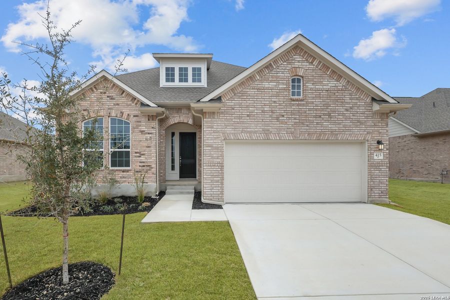Front exterior of a new home in Foxbrook, Cibolo, TX, highlighting curb appeal (Image 21). Front exterior of a new home in Foxbrook, Cibolo, TX, highlighting curb appeal (Image 21).