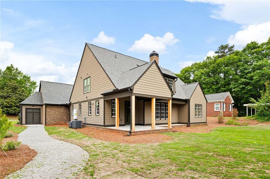 Front exterior of a new home in , Carrollton, GA, highlighting curb appeal (Image 30).