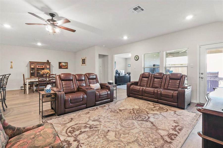 Living area featuring recessed lighting, light wood-style floors, and ceiling fan