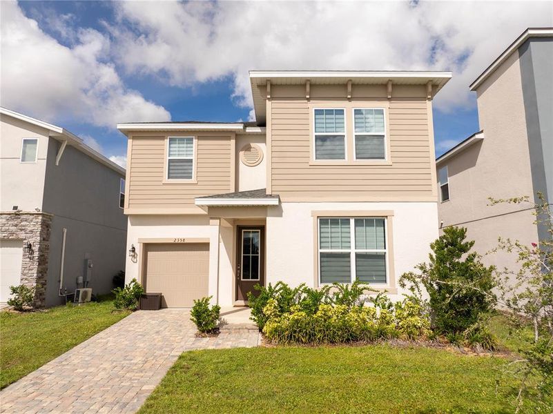 Front exterior of a new home in , Kissimmee, FL, highlighting curb appeal (Image 20).