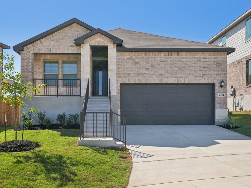 Front exterior of a new home in Comanche Ridge, San Antonio, TX, highlighting curb appeal (Image 1). Front exterior of a new home in Comanche Ridge, San Antonio, TX, highlighting curb appeal (Image 1).