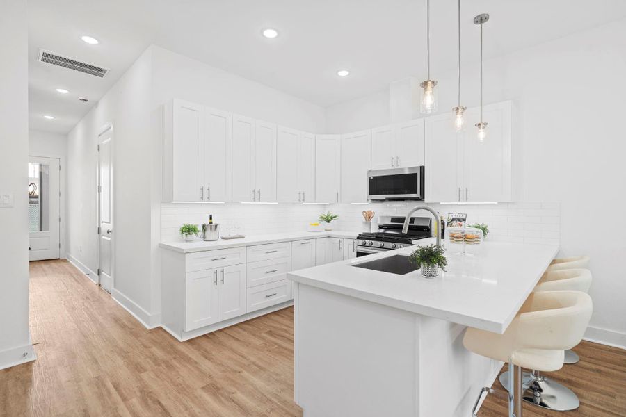 No visible outlets along the backslash - cleverly hidden under the cabinets
