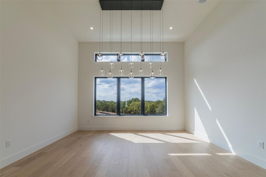 Unfurnished living room with light wood-type flooring and recessed lighting