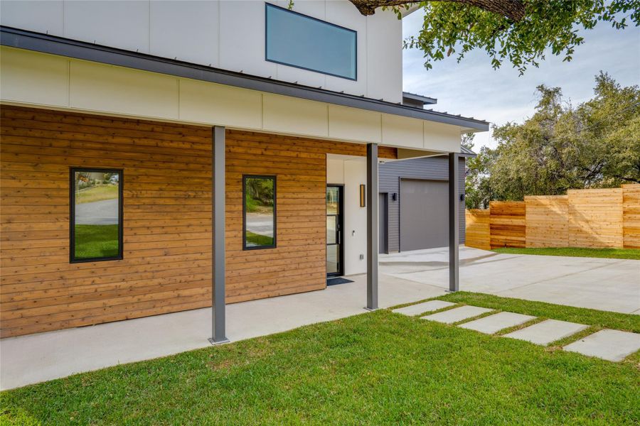 Rear view of property featuring a lawn