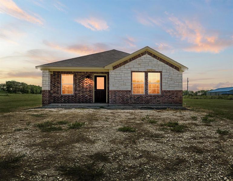 Front exterior of a new home in , Itasca, TX, highlighting curb appeal (Image 1). Front exterior of a new home in , Itasca, TX, highlighting curb appeal (Image 1).
