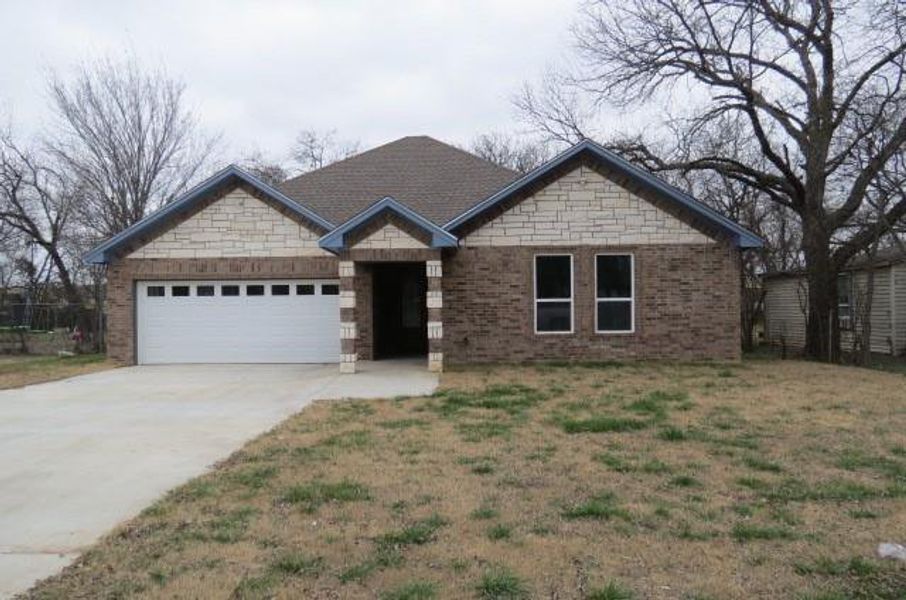 View of front of property with a garage