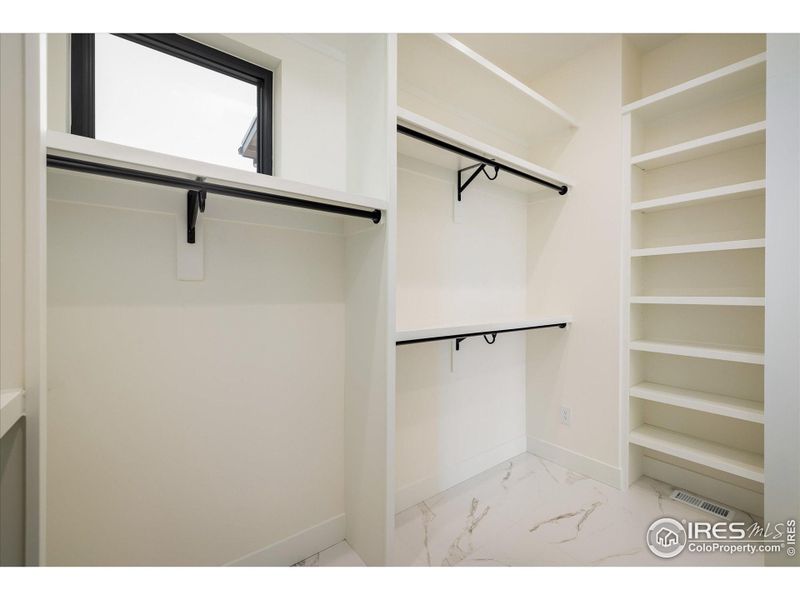 Main Floor Primary closet is filled with natural light!