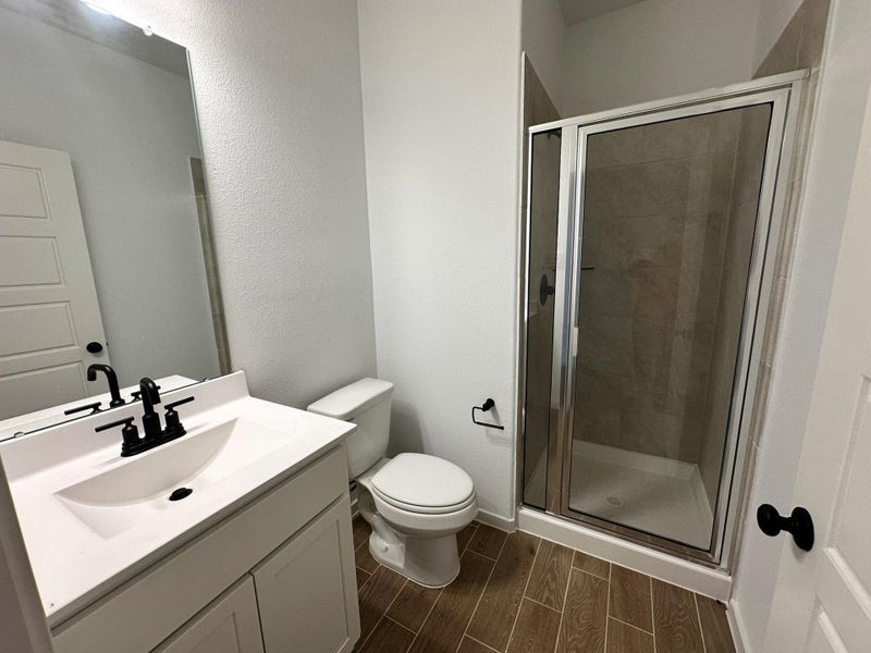 Furnished interior view inside a new home in Creekhaven, Iowa Colony (Image 4).