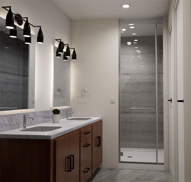 Bathroom featuring double vanity, a shower stall, and recessed lighting