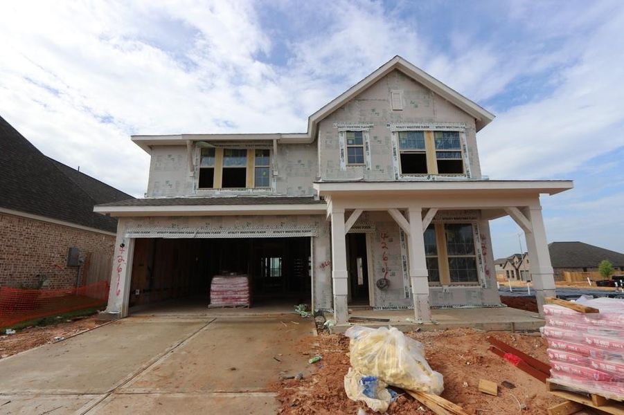 Front exterior of a new home in Escondido 45’ Homesites, Magnolia, TX, highlighting curb appeal (Image 17).