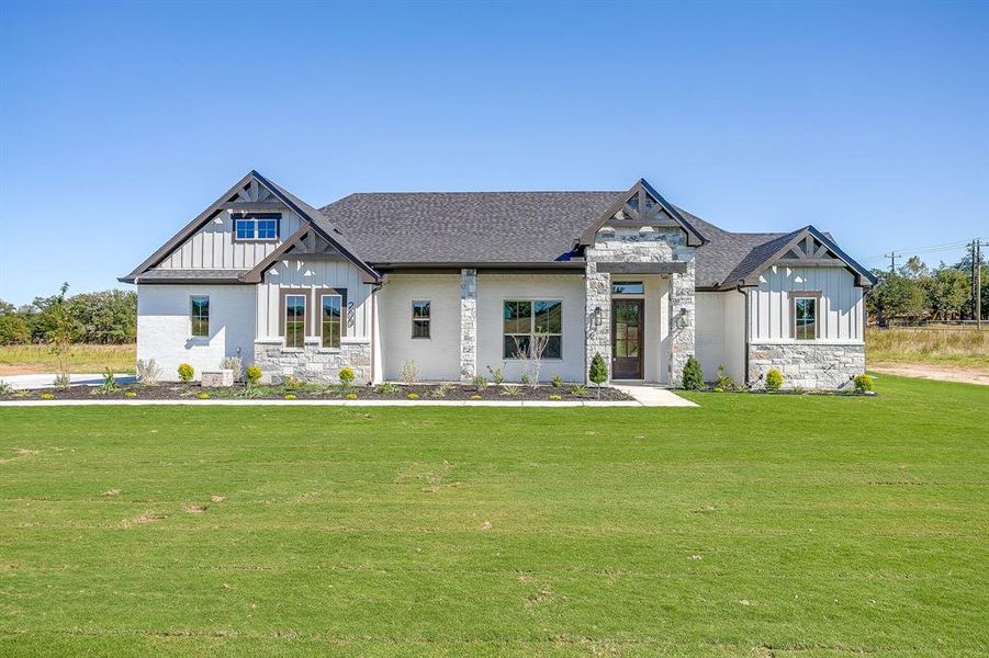 Front exterior of a new home in , Poolville, TX, highlighting curb appeal (Image 23). Front exterior of a new home in , Poolville, TX, highlighting curb appeal (Image 23).