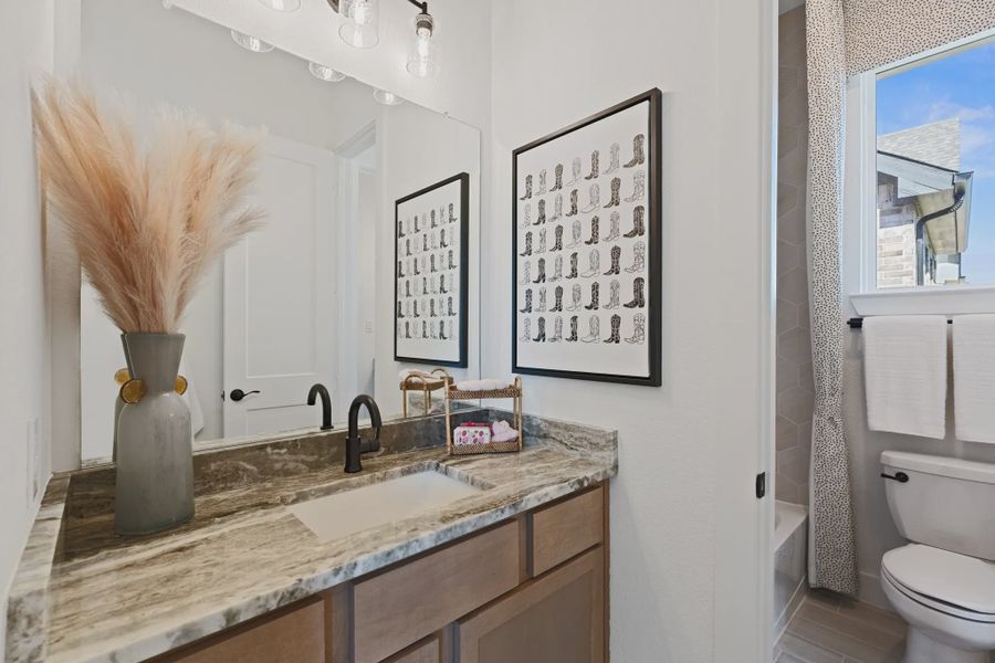 Representative furnished interior of a home built from the Sweetwater by Chesmar Homes in Meridiana 50's and 60's, Manvel (Image 22).