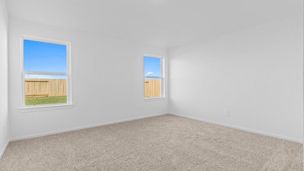 Spacious, unfurnished interior of a new home in Caldwell Crossing, Iowa Colony (Image 12).