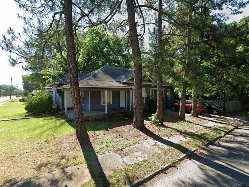 Ranch-style home featuring covered porch and a metal roof Ranch-style home featuring covered porch and a metal roof