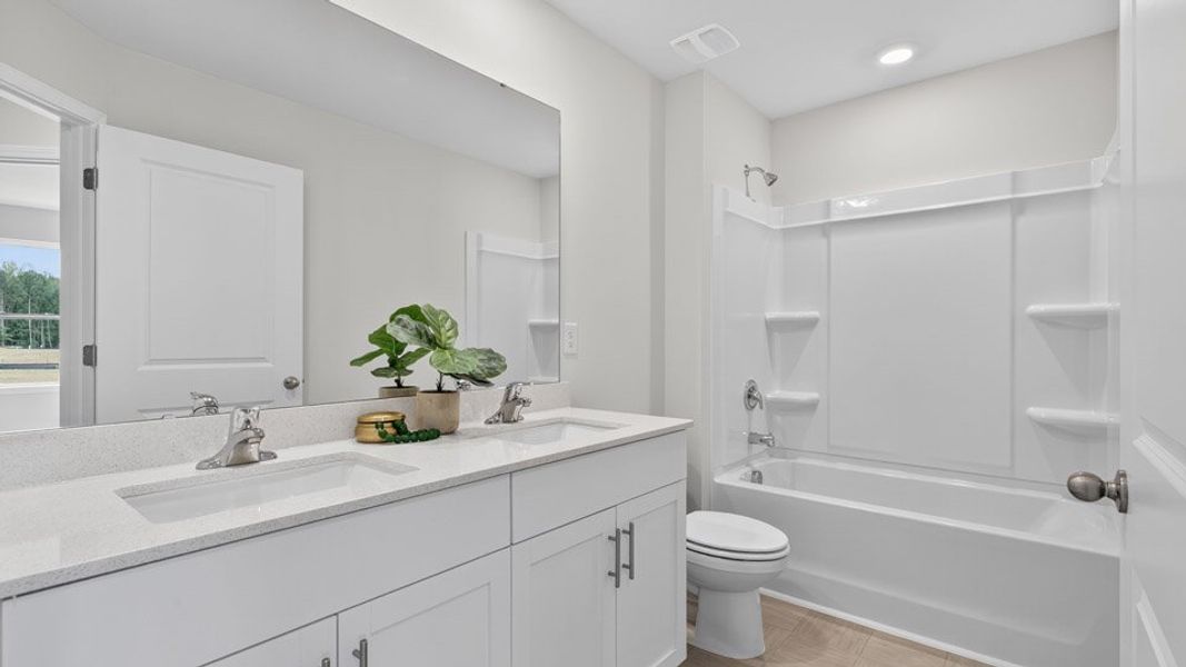 Representative furnished interior of a home built from the Blake by D.R. Horton in The Townes at Anderson Farm, Wendell (Image 13).