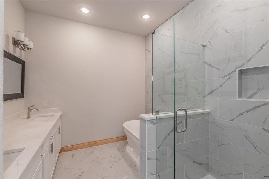 Bathroom with vanity and independent shower and bath