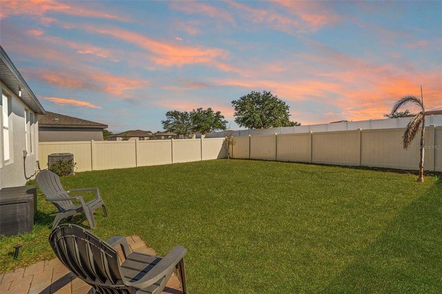 Exterior details and patio area of a home in Deer Run at Crosswinds, Davenport (Image 31).