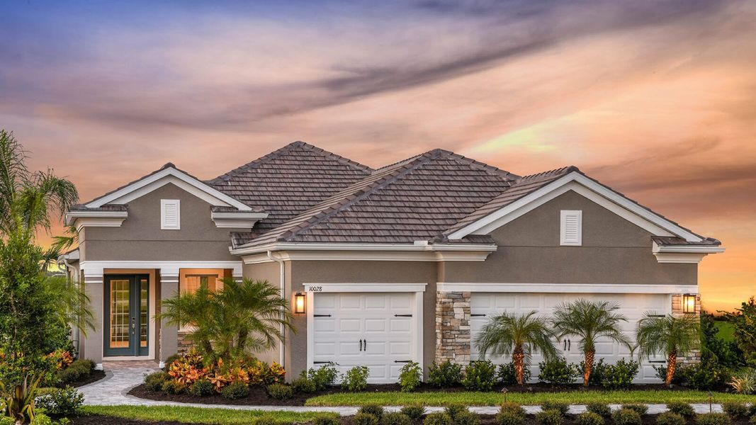 Front exterior of a new home in Grand Park Real Estate and Homes for Sale in Sarasota, FL - Neal Communities, Sarasota, FL, highlighting curb appeal (Image 24). Front exterior of a new home in Grand Park Real Estate and Homes for Sale in Sarasota, FL - Neal Communities, Sarasota, FL, highlighting curb appeal (Image 24).