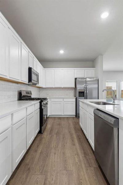 Kitchen in the Oscar home plan by Trophy Signature Homes – REPRESENTATIVE PHOTO